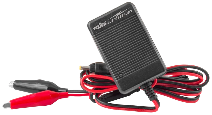 Vexilar Lithium Battery Chargers (Charger Only) featuring a compact black charger box with ribbed texture and attached red and black alligator clip cables for marine electronics and fishing tackle use.