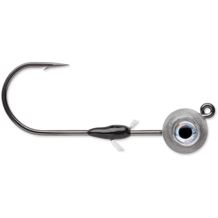 VMC Minnow Shaker Jig featuring a single sharp hook, weighted rounded head with realistic eye detail, and a wire weed guard designed for fishing tackle use.