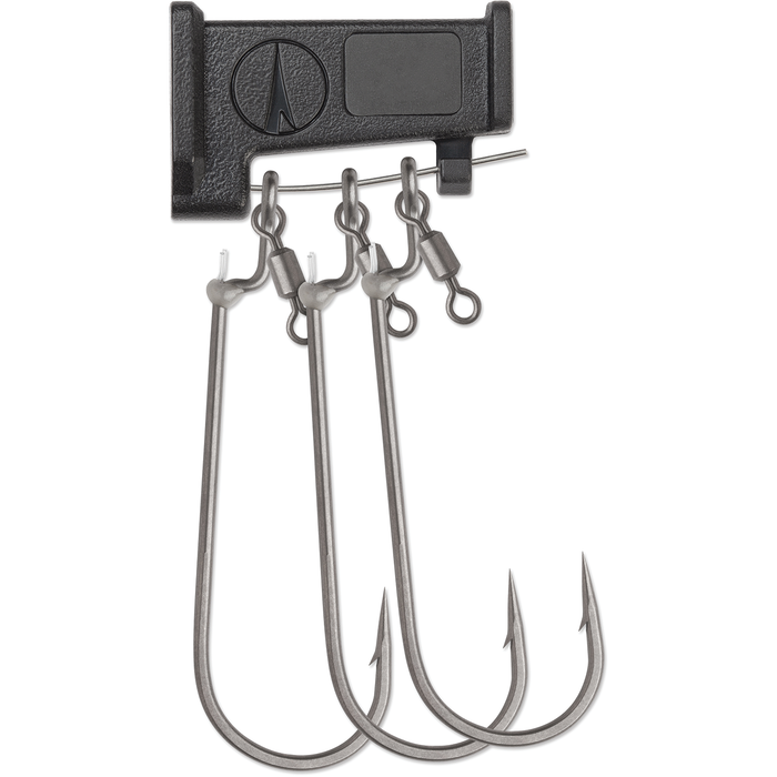 Three metallic fishing hooks with swivels attached to a black plastic holder, designed for secure and effective bait presentation, identified as VMC RedLine Series Swivel Fluke Hooks.