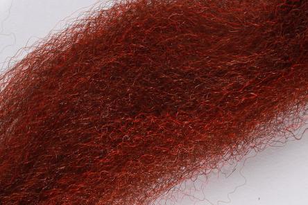 Close-up of reddish-brown Wapsi Fuzzy Fiber material used for fly fishing lures, showing fine, soft fibers ideal for creating lifelike fishing tackle.