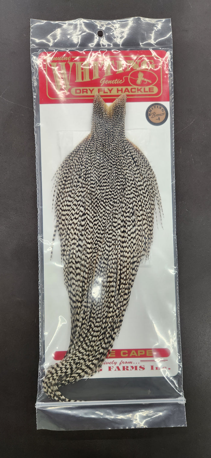 Whiting Rooster Bronze Full Dry Fly Cape in clear packaging, showing natural brown and black mottled feather pattern for fly fishing tackle.