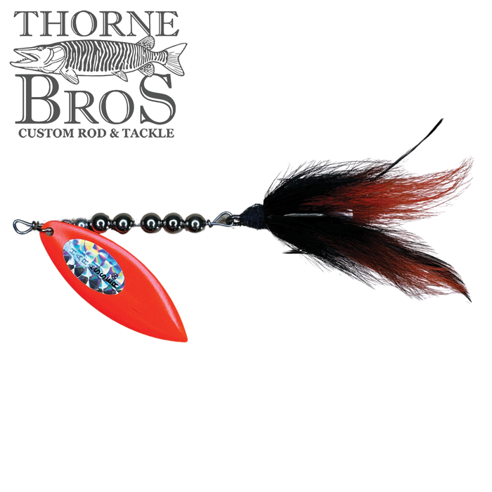 Windels Magnum Pike Harasser fishing lure with bright orange spinner blade, black and red feathered tail, and black beads, designed for musky fishing tackle.