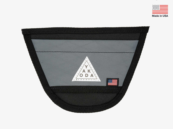 Yakoda Net Holster in slate gray with black trim, featuring a triangular Yakoda logo patch and a small American flag label, designed for fishing tackle storage and convenience.