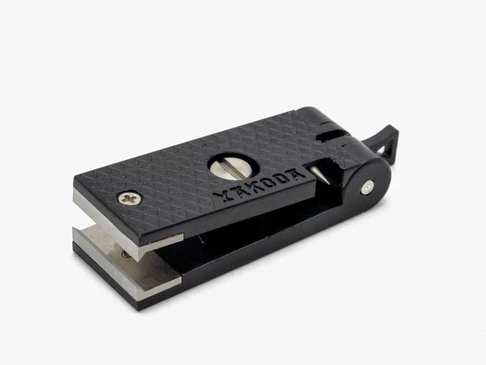Yakoda Nippers fishing tool with compact black textured body and metal cutting blades, designed for precision cutting of fishing tackle and lines.