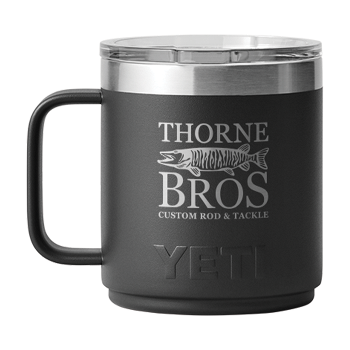 Yeti Thorne Bros. Logo Rambler 10oz. Mug - w/ MagSlider Lid in matte black with Thorne Bros. logo and fish graphic, stainless steel rim, and black handle for fishing enthusiasts.