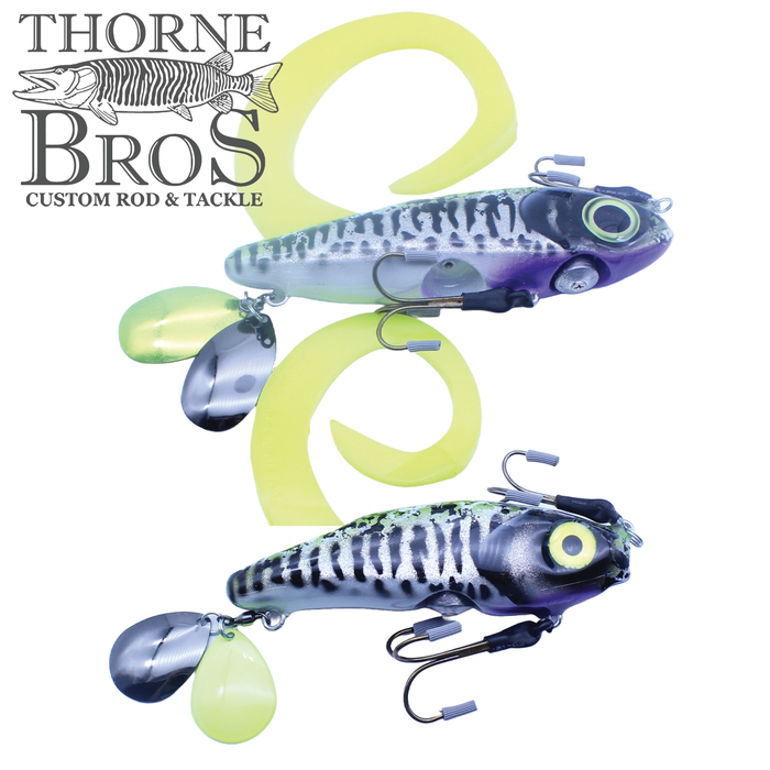 Two detailed fishing lures with curved yellow tails and metal spinner blades, designed for musky fishing, displayed with Thorne Bros logo and featuring the Zilla Baits Gladiator (Mini & Standard).