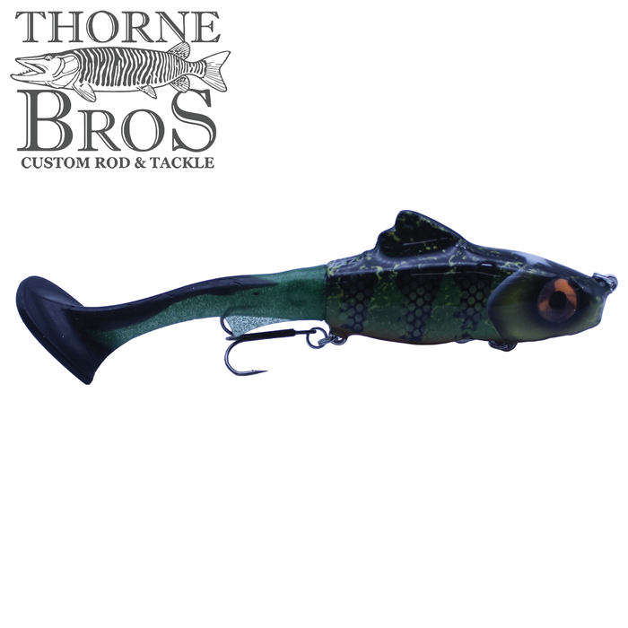 Zilla Baits Junior Hooker fishing lure with a lifelike green and black segmented body, orange eye detail, and a soft tail designed for musky fishing tackle.
